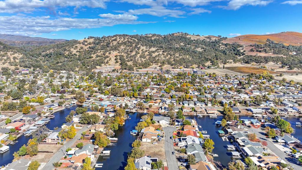 This level, buildable double lot in the sought-after Clearlake Oaks Keys offers ample space for your dream home(s). Located on a paved road in a friendly neighborhood, the property is just steps away from canal access at the rear. With both water and sewer connections already in place, its ready for construction. Water service requires only a $50 transfer fee and a $119 monthly base rate. The HOA fee is just $85 annually, and membership to the community pool center is optional.