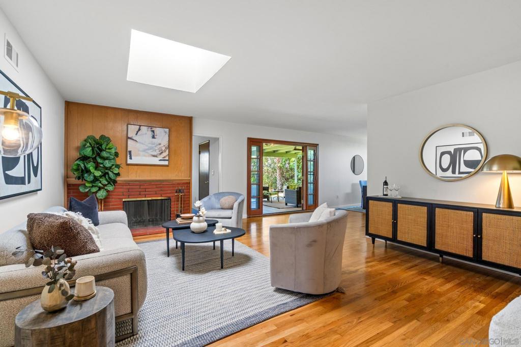 Welcome to this stunning West University City Gem! This Single Level 4 Bed 2 Bath home with 2,219 square feet sits on a 14,600 square foot lot of usable land. An additional bonus room provides flexibility, easily transforming into a fifth-bedroom or a home office. Upon entering, you are greeted by freshly painted interiors and newly refinished wood floors that exude warmth and style. The living room features a cozy fireplace, offering a perfect setting for relaxation. The kitchen and dining areas flow effortlessly into an expansive two-tiered backyard. This outdoor oasis is an entertainer's dream, featuring a gorgeous patio with panoramic canyon views, fresh turf on the upper level, and a lap swimming pool on the lower tier. There's ample space for a potential pool house or accessory dwelling unit (ADU) on lower level. With its 2-car garage and proximity to the scenic Rose Canyon trails and vibrant La Jolla beaches, this home epitomizes easy, elegant living. This neighborhood features top-rated schools and easy access to freeways, shopping, dining & parks. Discover the endless possibilities this property offers and envision your future in this beautiful home!