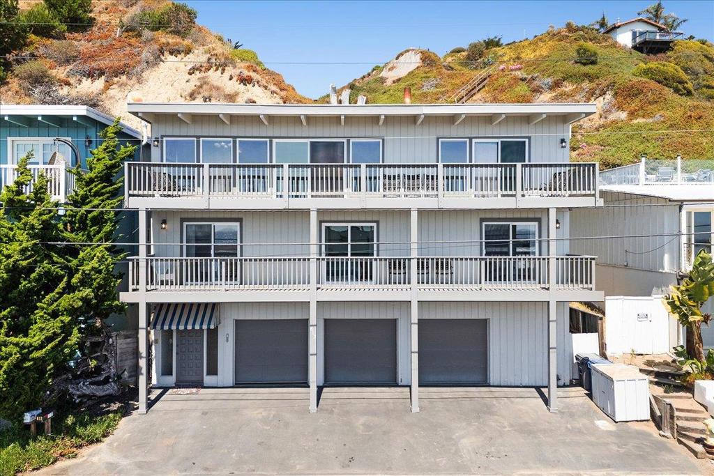 This charming coastal retreat offers sweeping Monterey Bay views from the kitchen, living room, and all 4 bedrooms. Located securely behind the gate in the Rio Surf & Sands community, the setting is unmatched. The great room showcases open-beam ceilings and a wall of glass that opens to the deck for effortless indoor/outdoor living. Kitchen, living, and dining flow together for easy entertaining and everyday comfort, and the floor plan provides excellent separation of space across three levels. Approximately 2,000 sq ft of living space plus a rare 3-car garage means plenty of parking and room for boards, bikes and beach gear. Positioned along the gentle hillside, the property, per seller, sustained no notable damage during the storm surges of the last two winters. From here you are minutes to Seacliff State Beach, Seascape Golf Course, and world-class hiking and mountain biking in The Forest of Nisene Marks State Park. Close to surf breaks, coffee, shopping, and dining - this isn't just a beach house - it is a launchpad for your Aptos lifestyle. Enjoyed by this family for over 30 years and surrounded by exquisite custom homes, the value and upside potential at this Beach Drive address are exceptional.