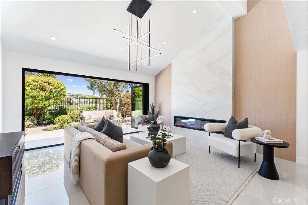 Architecturally Reimagined Custom Luxury Home in Monarch Pointe. Complete Transformation with Second Story Addition & Designer Finishes Throughout. Welcome to a truly unique custom residence in the prestigious Monarch Pointe community of Laguna Niguel. This home has been completely rebuilt and reimagined with a new second story, top-tier materials, and masterfully executed design throughout. It’s more than a renovation—it’s a transformation crafted for the most discerning buyer. Offering approx. 2,300 sq ft of luxury living space, plus an additional ~92 sq ft finished storage room (not included in total), the home’s new second floor features two bedrooms, a full bath, and integrated storage. Every aspect of this property reflects custom craftsmanship, spatial flow, and intentional design. Inside, you’ll find dramatic slab feature walls, European-style cabinetry, floating vanities, and bold designer tile throughout. The chef’s kitchen is a standout with Miele smart appliances, integrated cooktop ventilation, built-in coffee station, and a waterfall-edge island that blends form with function. The open-concept layout flows beautifully for entertaining or quiet evenings at home.
Three spa-inspired bathrooms offer a freestanding soaking tub, LED anti-fog mirrors, and Kohler smart toilets. A custom walk-in closet is tailored for both elegance and organization. Natural light fills the interiors, accentuating clean lines, soft textures, and modern finishes. Smart home features include fingerprint entry, a video doorbell, and app-based controls for security and convenience. All major systems—HVAC, plumbing, electrical, and a 75-gallon water heater—have been fully replaced, offering comfort and long-term peace of mind. The exterior is equally refined, with professional landscaping, a tranquil water feature, expanded tile hardscape, modern fencing, and epoxy-coated garage flooring that enhance the home’s sophisticated curb appeal and outdoor living experience. Located in a coastal enclave with ocean-view trails, this home delivers elevated Southern California living—architectural excellence, coastal charm, and contemporary luxury all in one extraordinary residence. Enjoy nearby beaches, parks, upscale dining, shopping, and recreational amenities within a serene, welcoming community perfect for families and entertaining alike. This home truly offers the ultimate blend of style, comfort, and convenience — a remarkable place to call your own.