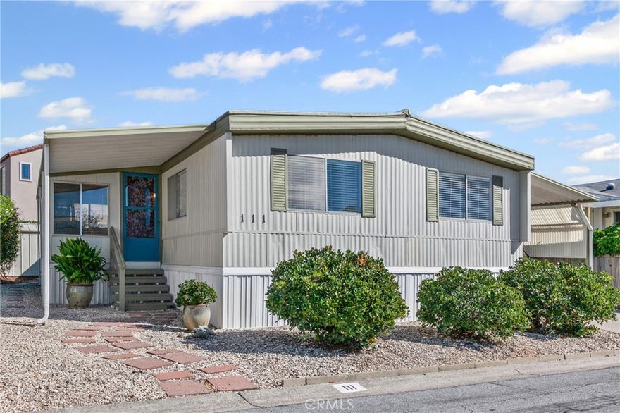 This delightful 2 bedroom/1 bath Sandpointe Mobile Home is in great condition.  The large living room has great sunset views to the west.  There is a large enclosed porch room that could be used as an office.  The kitchen is nice sized and has a laundry area.  Each bedroom is also nice sized and have large, spacious closets.  The hallway has a skylight to let light in.  The kitchen , dining room and bathroom have dimmer lights.  This home is located on a large yard that has a beautifully landscaped patio area and has two storage sheds.  The home is located on a large lot that could accommodate a larger new home.  The lot is included so there is no space rent.   Chumash Village has two swimming pools and a spa.  The large community room has a billard room.  This home is priced to sell at $435,000. The Association Fees of only $284.