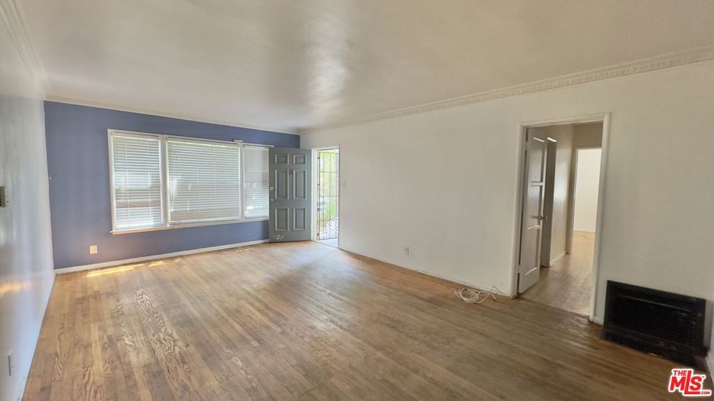 This spacious 1-bedroom apartment feels more like a home. It comes with one parking space, which is a big plus in Mid-City where street parking is hard to find. The unit is currently being remodeled and will be ready soon. It offers a comfortable layout with lots of space and natural light. Great location close to shops, restaurants, and easy freeway access. A solid place to live in a busy part of LA. Owner pays for water. Renter is responsible for gas and electric. Last month's rent due at signing.