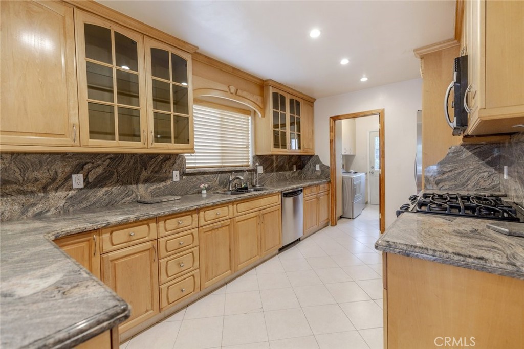 From the moment you arrive, you will be charmed by the exceptional curb appeal of this beautifully maintained home. As you enter, you are welcomed by an open, bright floor plan, filled with natural light that creates a warm and inviting atmosphere throughout.
The gleaming hardwood floors, re-polished in 2022, flow seamlessly throughout the home, adding a touch of sophistication. The living room is the perfect space for both relaxation and entertaining, featuring recessed lighting, expansive windows that let in abundant sunlight, and a cozy wood-burning fireplace, ideal for cool evenings.
The chef's kitchen is a dream come true, with ample cabinetry, beautifully crafted granite countertops, sleek tile flooring, and high-end stainless steel appliances. Whether you are cooking for a crowd or preparing a quiet meal, this space has everything you need. Plus, the sale includes all appliances—stove, microwave, refrigerator, dishwasher—and even the washer and dryer.
The roof was thoughtfully replaced in 2022, ensuring peace of mind for years to come. The bedrooms are generously sized, offering plenty of space for rest and relaxation. The two bathrooms are both stylishly updated, with one featuring a luxurious jacuzzi tub, barely used by the seller, and a stand-up shower, while the other boasts beautifully tiled walls and floors.
Comfort is key, and with central A/C, you will be cool on hot summer days and warm on chilly winter nights. The home also offers an abundance of storage space, so you will never be short on room for your belongings. Plus, the entire house was freshly painted within the last two years, making it feel like new.
The two-car attached garage provides convenience and security, though note there is no direct access from inside the house.
Outside, you will find a spacious backyard perfect for entertaining guests. Enjoy the variety of fruit trees including pomegranate, fig, apple, guava, quince, peach, and orange—a true gardener’s paradise.
This is not just a home; it is a place where memories are made. Come see it for yourself.