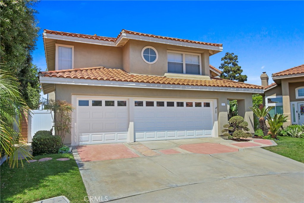 Welcome to 9221 Belcaro, a former model home in the most sought after and gated community of Huntington Court! This coastal elegant home provides comfortable living and spacious layout to entertain inside or outside. Upon entering the home, the dramatic volume ceilings of the living room and dining room, statement fireplace, oversized backyard are breathtaking but chefs will love the gourmet kitchen with an abundance of storage, custom island, six burner gas cooktop, double oven and overlooking the backyard and family room. There are three bedrooms and 2.5 bathrooms with a large laundry room and an amazing bar area for entertaining friends and family. Retire to the master suite that has cathedral ceilings and enjoy gorgeous views and spa-like bathroom with high-end finishes, dual sinks, large soaking tub, private water closet and walk-in shower and walk-in closet. Both Jack and Jill bedrooms upstairs have large closets and a bathroom with dual sinks and a shower. Architectural and lot elements are two fireplaces, skylight, abundance of windows, volume ceilings, minutes to the ocean, a private and large backyard with no neighbors directly in the back. Exterior design of the home was infused with the Coastal California ethos with vibrant and mature vegetation and fruit trees blending into the refined cement work and hardscape. Three car garage with cabinetry and shelving provides enough room to store all of your belongings. The sought after Prestigious school district including Eader Elementary, Sowers Middle school, SSJ and Edison High School are within walking distance. Huntington Court is centrally located and minutes to shopping areas like Trader Joes, Vons, Chipotle, Sprouts, Starbucks, Whole Foods, Smart & Final and close proximity to world class beaches, and Surf City’s famed “Main Street" and shops/restaurants at Pacific City.