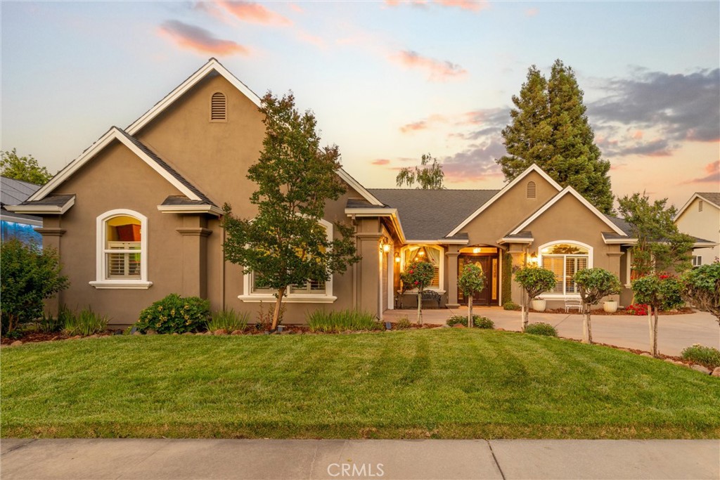 Step into this exquisite Tuscan-inspired sanctuary where timeless design meets contemporary comfort. This beautifully crafted 4-bedroom, 3-bath home spans over 2,500 sq ft of elegant living space. From the grand entry with soaring ceilings to the fine crown molding and plantation shutters in every room—including the garage—no detail has been overlooked. Enjoy the energy efficiency of solar power, keeping you cool in summer and cozy in winter. The formal dining room is perfect for hosting special occasions, while a cozy breakfast nook beneath a lighted dome ceiling offers a serene start to your day. The gourmet kitchen boasts upgraded cherry wood cabinetry, quartz countertops, a walk-in pantry, Italian medallion backsplash, custom stone range hood, gas stove, and premium stainless appliances. The spacious family room with a gas fireplace flows effortlessly into the private backyard oasis—lushly landscaped with mature trees and a manicured lawn. The primary suite features a fireplace, spa-style jetted tub, walk-in shower, dual vanity, and direct access to a covered patio with skylight. Two guest rooms feature en-suite baths, and the fourth bedroom—perfect as an office or den—overlooks the pristine front yard. Upgraded lighting, ceiling fans, and thoughtful design enhance every room. Located near PV High, Marigold Elementary, parks, and premier shopping. This home is a rare blend of luxury, charm, and enduring quality.