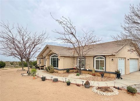 Photo of 7915 Outpost Road, Oak Hills, CA 92344 (MLS # HD25278392)