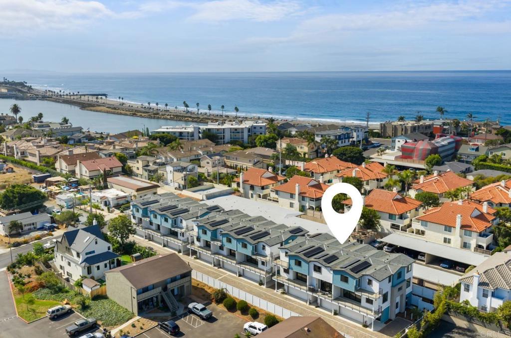 NEW construction, 2 blocks to Tamarack Beach! Experience coastal luxury at The Currents—a brand-new enclave of nine modern townhomes just steps from Carlsbad’s sunlit Tamarack Beach. *Builder is offering a generous rate buydown incentive. Special financing options available to qualified buyers.* Nestled on Chinquapin Avenue, this exclusive community seamlessly blends contemporary design with timeless seaside charm. 324 Chinquapin is a 2 bedroom, 2.5 bath, 1,525 sq. ft. residence thoughtfully designed for effortless indoor-outdoor living with a deck off the main living area and open-concept layout that invites natural light throughout. High-end finishes define the interior: a chef’s kitchen with Wolf and SubZero appliances, quartz countertops, and an oversized island; stylish LVP flooring; designer-selected tile, lighting, and hardware; plus Delta and Kohler plumbing fixtures. The living room extends seamlessly to a deck via stacking Western doors, while the primary suite offers a spa-like bath and spacious walk-in closet. Additional highlights include convenient third-floor laundry and an attached oversized, tandem two-car garage finished with epoxy floor. Smart, sustainable features—owned solar and integrated home technology—enhance convenience and efficiency. Ideally situated two blocks from Tamarack Beach, steps from the Agua Hedionda Lagoon, and within walking distance to downtown Carlsbad Village, The Currents offers an unparalleled lifestyle. From morning runs along the coastline to sunset strolls through the Village, this is more than a home—it’s your gateway to coastal adventure and laid-back luxury living.