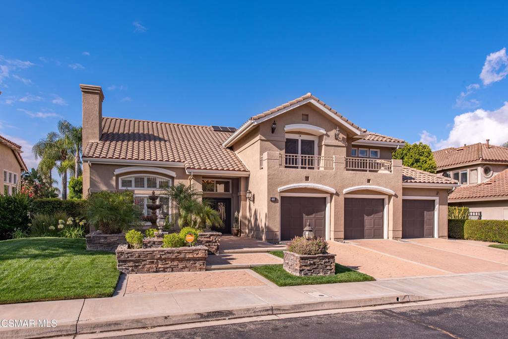 This stunning 4-bedroom, 3.5-bath estate is a true blend of elegance and comfort, nestled in the prestigious gated community of Legacy Estates in Wood Ranch. From the moment you arrive, you're welcomed by custom wrought iron and glass double doors that open to a dramatic entry with soaring 20-foot ceilings and a show-stopping chandelier.The thoughtfully designed floor plan features a spacious formal living room with a fireplace that seamlessly flows into the formal dining room, both adorned with exquisite custom chandeliers. Plantation shutters are featured throughout the home, adding timeless beauty and light control.The chef's kitchen is a dream, showcasing two center islands--an oversized island ideal for entertaining and a smaller prep island for functionality., While there's no walk-in pantry, you'll enjoy generous cabinet space and nearby storage options. The kitchen opens gracefully to the family room with custom built-ins, creating a warm, connected space for everyday living.A luxurious main-level primary suite offers its own fireplace and a private sitting area, perfect for relaxing evenings. Upstairs you'll find three additional bedrooms and two full bathrooms.Additional highlights include a spacious indoor laundry room, a 3-car garage, and a backyard designed for entertaining--with a covered patio featuring a fireplace and a custom spa with waterfall.Enjoy the community pool and the convenience of being moments from the Wood Ranch Golf Course and Country Club, the Ronald Reagan Library, and an easy commute to both Ventura and Los Angeles.Welcome to the lifestyle you've been waiting for at 48 Golden Glen Drive.
