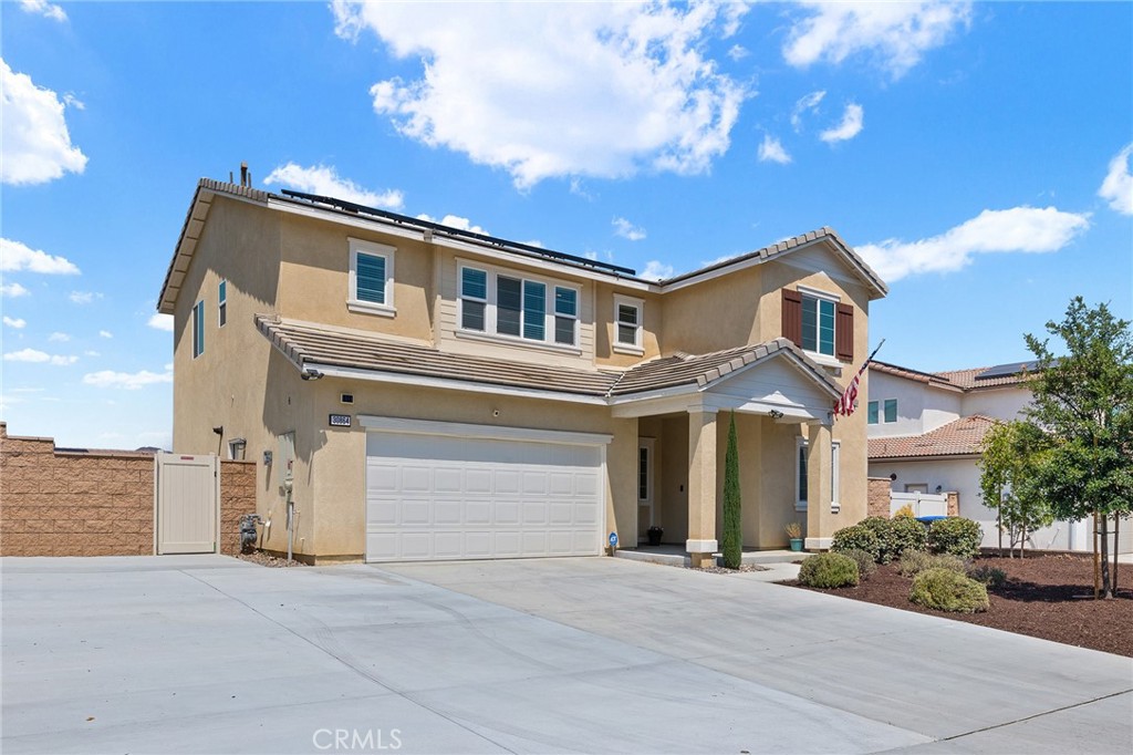 From the spacious 6 car driveway with potential for RV pull through and gated RV parking, to the massive pool sized backyard with mountain views and endless possibilities, this almost-new home has everything your family needs! As you enter the home, there is a bedroom and full bathroom on the first floor perfect for multi generational living and potential Next Gen space. The open floor plan leads you to a Chef's kitchen equipped with smokey grey cabinets, a separate pantry, granite countertops and stainless steel appliances. There is also an extra storage closet and plenty of natural light as the kitchen and living room have views of the backyard and also of the San Jacinto mountains. The backyard features stamped concrete, drainage, flower beds with retaining wall, gas and electrical connections and plenty of room for the swimming pool of your dreams! Upstairs you will find a huge loft, game room or flex area and a spacious laundry room with cabinets and a separate pet or utility room. Also upstairs, you will find 3 additional bedrooms and two bathrooms including the oversized primary bedroom with gorgeous views of the mountains and an en suite primary bathroom with granite countertops, vinyl flooring and a large walk in closet. Some of the upgrades of this home include: vinyl flooring, upgraded ceiling fans, window treatments throughout, smart door bell camera, smart hub for security system, fire sprinkler system and PAID SOLAR! All within minutes of shopping and dining in both directions! Come see your new home today!