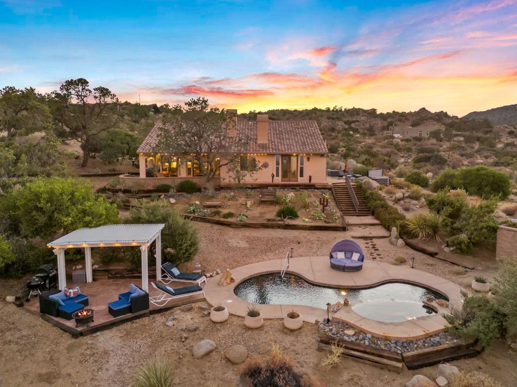 This Spanish-style mountain retreat offers sweeping Coachella Valley views from 2.5 private acres--where nature is truly on your doorstep. Walk to your favorite meditation rock, explore incredible hiking without the climb, and enjoy a dog-friendly neighborhood with biking trails, community walks, and star-filled skies.The main house features 2 bedrooms, a large office, 3 full bathrooms, and a walk-in laundry room. Saltillo tile floors, wood-beamed ceilings, and fireplaces in both the living room and primary suite add warmth and charm. The spacious gourmet kitchen invites everyone to pitch in.The detached casita offers a full kitchen, full bathroom, and private courtyard--ideal for guests or extended stays.Outside, relax by the private pool, soak in the separate jacuzzi under the stars, stretch in the yoga gazebo, or nap in the hammock. With multiple patios and seating areas, you'll find endless spots to dine, unwind, and take in the million-dollar views--especially at sunset.Just 20 minutes to fine dining and shopping on El Paseo--this isn't just a home, it's a lifestyle rooted in peace, privacy, and mountain magic.