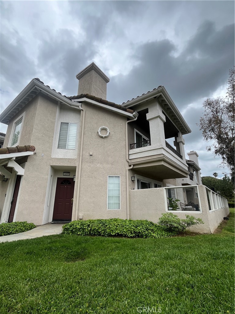 Price Reduced $30K PLUS an additional $10K CASH CREDIT for added touches you may like. Welcome home to 1057 Dewcrest! A bright and inviting home nestled within the gated enclave of the Viewpointe community where comfort meets convenience, and every details enhances your lifestyle. This cozy single-level condo is a great opportunity to live in this very desirable neighborhood. This 2 bed / 2 bath home is a special end unit with an open floorplan featuring plenty of refreshing daylight thru large windows and sliding doors complemented by a cozy fireplace perfect for relaxing evenings. The kitchen offers ample storage and has a partial opening to both the living and dining room, allowing for effortless entertaining. There are large bedrooms, an inside laundry, and an attached garage. In addition to a 1-car garage, there is an additional, covered and assigned parking space. The home has new flooring and fresh interior paint. The enclosed glass patio can be enjoyed for meals or coffee and oversees a beautiful view where you can take it all in! Viewpointe HOA offers the perfect space for residents to relax whether they wish to enjoy the pool/spa, BBQ or sit around the fire pit. Dewcrest offers an easy commute to excellent schools and freeways, but is just far enough away from the hustle and bustle, making it the perfect place to call "home!" Don't miss this chance...Call to schedule a private tour today!