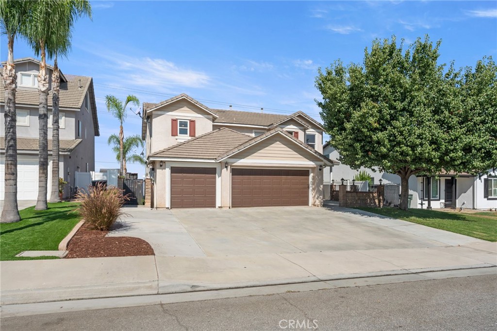 This stunning 5-bedroom, 3-bathroom home is located in one of Riverside’s most desirable neighborhoods, offering both comfort and convenience. From the moment you arrive, the front courtyard with lush potted plants and a cozy covered porch seating area sets the tone for what’s inside. Step through the doors and discover a spacious floorplan with thoughtful updates throughout. The remodeled kitchen features modern upgrades perfect for entertaining, while fresh interior paint creates a bright and welcoming feel. A downstairs bedroom and bathroom provide flexibility for guests, multigenerational living, or even rental income. Upstairs, the home continues to impress with generous bedrooms and abundant natural light. Practical features include a three-car garage with built-in attic storage, a 240-volt outlet for EV charging, and fully-owned solar panels (24 total) for energy efficiency. The extended driveway offers parking for four vehicles, plus RV hookups with water, electrical, and sewer access. The backyard is truly a private retreat designed for entertainment and relaxation. Enjoy a 1,000 sq. ft. covered patio, a built-in barbecue island, fire pit lounge, 14-foot swim spa, and even a high-quality steel swing set. Framed by new white vinyl fencing with solar lighting and a block wall for privacy, the yard backs to open land, giving you breathtaking sunset views with no rear neighbors. Additional upgrades include granite countertops, hardwood floors, updated lighting, and a remodeled bathroom vanity. Every detail of this home reflects pride of ownership. Don’t miss your chance to own this incredible Mission Grove home, schedule your private tour today!