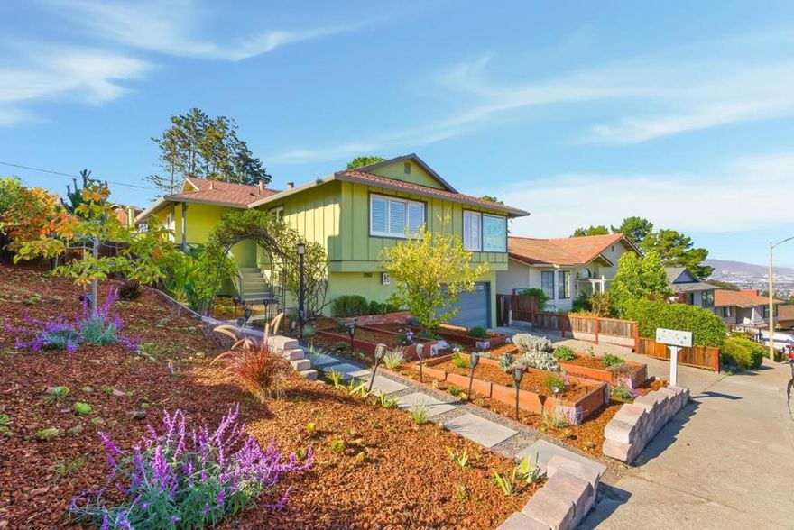 Perched above the Bay with sweeping views of shimmering water and Mount Diablo, this elegant home blends classic comfort with modern design. Built in 1961, the 1,750 square foot main level features an open floor plan, a remodeled chef's kitchen with professional appliances and pantry, and spacious living and dining areas ideal for entertaining. Three bedrooms and two baths complete this level. Downstairs there are 770 sq ft of unpermitted flexible living space. An ideal in-law unit includes 1 bed, full bath, living area, kitchenette with refrigerator and a second washer/drier with direct access to the outdoors. Additional bonus room for office or hobbies.The spacious 9,414 square foot lot includes private terraced gardens lined with a multitude of fruit trees, tranquil seating areas, a sparkling pool, and a charming cabana. Nestled in a quiet neighborhood with easy access to freeways and SFO, this home captures the best of California's indoor-outdoor lifestyle. Buyer to verify all square footage, room count, and permit status of improvements to their own satisfaction with the appropriate city or county building department.  www.1345tuolumneroad.com