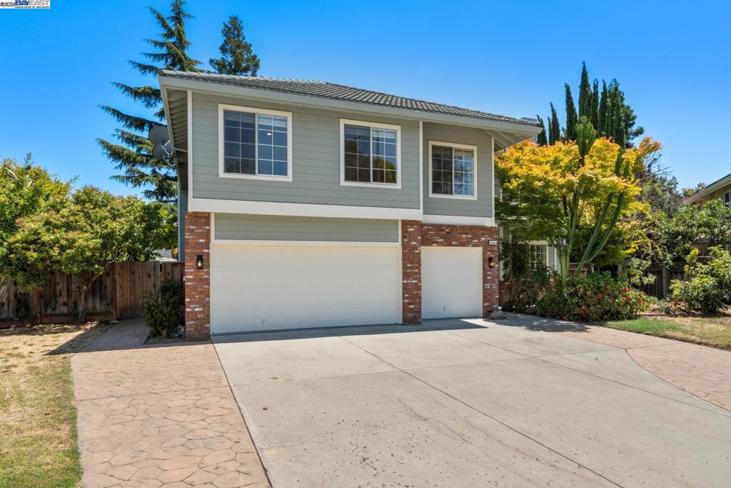A spacious and versatile home that combines a main residence and a private 2-story ADU-like unit. The main unit has 4 bedrooms (one downstairs) and 3 full bathrooms; the ADU-like unit has another 3 bedrooms (one without a closet), a simple kitchen, and separate access. Both units have a large backyard; the combined two units have 4,340 sq ft of living space with permit. Built in 1990 in a quiet cul-de-sac location right across from the award-winning Gomes Elementary school. Short walking distance to William Hopkins Jr High and MSJ High School. Dual-zone HVAC; central vacuum; vaulted ceiling foyer with spiral staircases; three fireplaces; three-car garage; dual-pane windows and patio door; hardwood floor, new ceiling lights throughout, and new interior & exterior paint. Close to Lake Elizabeth, City Library, shopping, BART, Gomes Neighborhood Park, I-680 & Hwy-84. Open House Sat. 8/2/2025 & Sun. 8/3/2025 from 1-4 PM.
