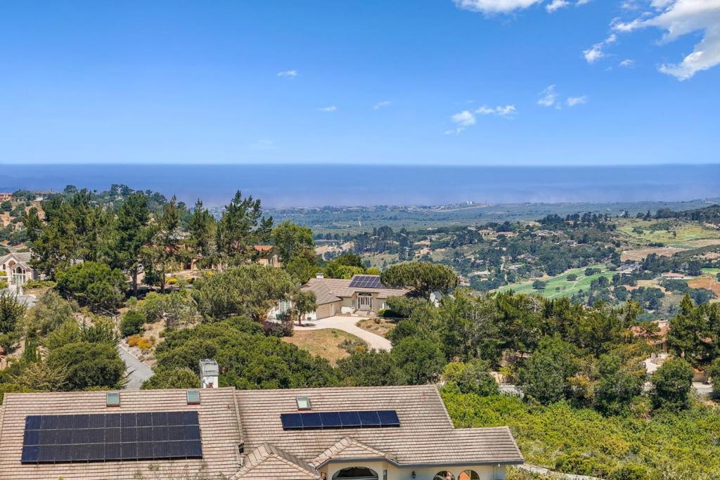 Bay Views, ADU, 8-Car Garage & More Set on a private 1.91-acre knoll with expansive views of the bay and the rolling hills along the Highway 68 corridor, this exceptionally maintained estate blends scale, comfort, and versatility. The main residence features vaulted ceilings, exposed beams, and sunlit living spaces that flow seamlessly to the outdoors. An oversized primary suite offers a serene retreat, while additional highlights include a media room and a 1,300-bottle wine cellar. The detached ADU adds flexible living options for guests or multi-generational needs. With an 8-car garage, owned solar, and true pride of ownership throughout, this home delivers efficient living and timeless appeal in a quiet, sought-after setting surrounded by natural beauty.
