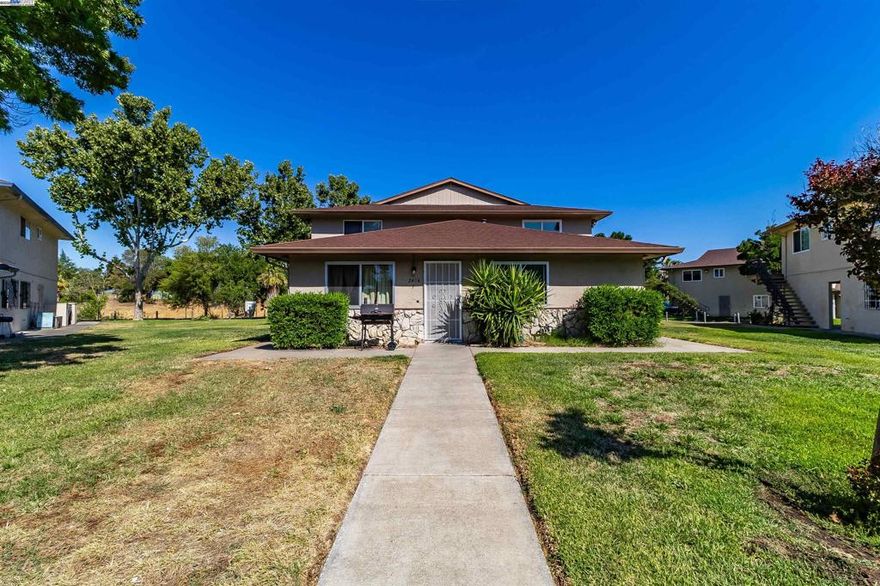 PRICE REDUCTION! 2 Bedroom 1 Bathroom Townhome In Antioch For Sale!  Newer Flooring Throughout Unit, Freshly Painted, Updated Air Conditioner, Fridge and Stove Included.  Kitchen Has Granite w/Full Back Splash.  Close Too Freeway Access, Schools, Public Transportation and Downtown Antioch. HOA Includes Pool, BBQ Area For Guests Who Want To Entertain, Water, Garbage, Sewer, Roof, Gutters, & More! 2 Car Garage Shared Carport Behind Townhome Which Can Also Be Used For Storage & Laundry Onsite For the 4 Units in the Building.  Come Take A Look At This Cozy Townhome!