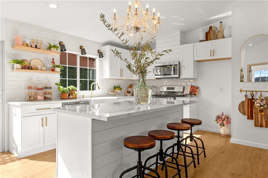 Owner will pay up to 2% points to buy-down (lower) interest rate.  Perched atop a serene hill-top, this ranch-like estate captures sweeping views of the valley and city lights at night.    This Farmhouse Designer Home has been upgraded with New Floors, New Bathroom Vanities, New Tile Work, New Doors, New Stainless Steel Appliances, New HVAC, New Roof and so much more!  Open Floorplan layout with Quarts Counters and Island Open to the Living Room.   Upgraded Light fixtures for a Designer Look.  Large Lot with room for future expansion.  Fenced around entire property.   Come Enjoy the Country-Like Feel but just minutes from Shopping, Restaurants and 215 or 15 Freeway.  Hurry this one will not last long!  Checkout the Virtual Tour Link for more Photos!