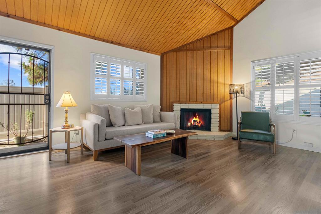This private single-story 2-bed/2-bath home welcomes you with vaulted ceilings that brings light and openness into the living area. The kitchen sits alongside the dining space with easy access to the large patio—perfect for pets, gardening, or entertaining. Plantation shutters throughout provide privacy, while a brand-new HVAC system combined with solar panels keeps the home cool efficiently and at low cost year-round. The master suite includes a walk-in shower and a walk-in closet with Elfa cabinets to maximize storage. The hallway bathroom features a walk-in jet stream tub, and the second bedroom functions as a true flex room—ideal as an optional guest room, office, or additional living space. Complete with an attached 2-car garage, community guest parking, and a prime location across from the Ralphs shopping center with quick access to the 54 freeway, this home combines practicality and convenience for first-time buyers or those looking to downsize.