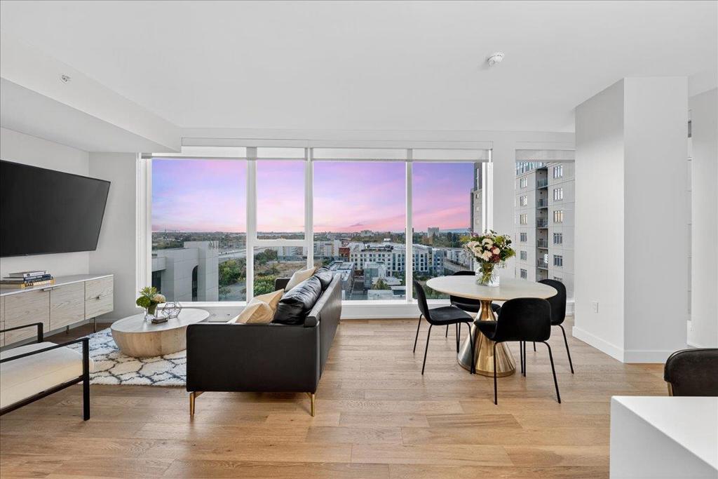 Elevate your lifestyle with this stunning 11th-floor 2-bed, 2-bath condo at the sought-after 188 West Saint James. Perched above the city, this home is filled with natural light and offers sweeping northwest views of treetops, rolling hills, and glowing sunsets. Enjoy a spacious, open-concept layout with wide-plank hardwood floors, a modern gas kitchen with quartz countertops, and premium stainless steel appliances. The primary suite features a walk-in closet and luxurious en-suite bath with dual vanities. A second bedroom and full bath offer flexibility for guests, a home office, or roommates. In-unit laundry, central A/C, and secure garage parking complete the home. Just steps to San Pedro Squares cafes, restaurants, and nightlife, and minutes to SAP Center, Adobe HQ, and SJC Airport. Commuting is easy with access to Caltrain, BART, and highways 87, 280, and 101. Enjoy resort-style amenities including a fitness center, lap pool, concierge, resident lounge, and more. Whether you're entertaining or unwinding, this home offers the perfect balance of luxury, comfort, and connectivity.