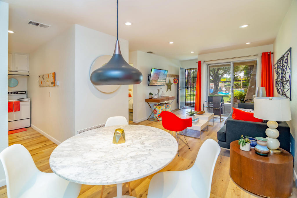 Beautiful Ground-Level Condo Near The Palm Springs Tramway.Welcome to your desert escape or ideal investment property! This charming bottom-floor condo is located in a sought-after community on the desirable north end of Palm Springs, just minutes from the iconic Palm Springs Aerial Tramway.Step inside to find a beautifully updated unit featuring wooden flooring as well as a modern functional kitchen with crisp white cabinets, The bathroom offers a newer vanity, stylish faucet, and additional wall cabinet storage for added convenience.Enjoy relaxing in the living room or step out onto the patio that offers serene views of the mountains and manicured grounds--perfect for morning coffee or evening sunsets. The unit is thoughtfully sized for easy upkeep and comes with a dedicated covered carport located just steps from your front door.This well-maintained community offers resort-style amenities including 5 sparkling pools and spas, 4 tennis courts, and lush greenbelt areas. Located just a short drive to downtown Palm Springs, shopping, dining, hiking, and quick freeway access for easy commuting.HOA dues are $550/month and include water, sewer, and trash--no lease land fees!Don't miss this opportunity to own a slice of paradise in one of Palm Springs' most convenient locations!
