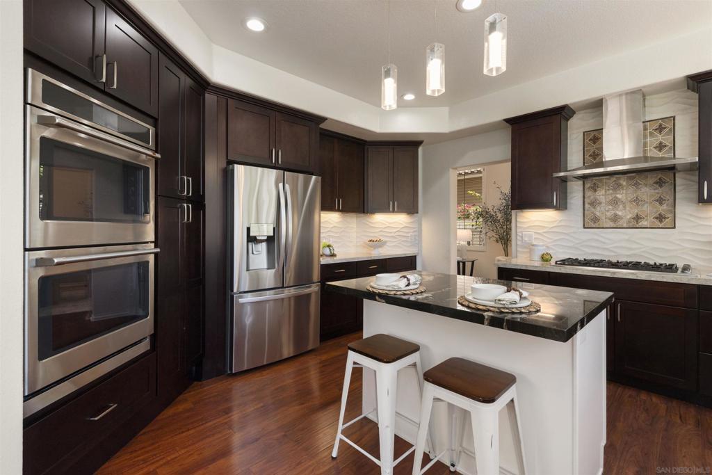This lovely home in Scripps Ranch’s Legacy/Prestige neighborhood offers 4 Bedrooms, 3 ½ Baths & just over 3,000sq.ft. of living space. The well-laid-out floor plan features a Full Bedroom & Bath downstairs w/direct access to the backyard. Ample storage in the spacious Remodeled Kitchen w/a wall of windows overlooking the refreshed backyard. The upstairs Primary Retreat boasts a fireplace, sitting area & ensuite bathroom; featuring dual sinks, deep soaking tub, separate shower & dual walk-in Closet. Be sure to check out he Private balcony off the Primary Suite and a second balcony shared by two front bedrooms. These two bedrooms also share a Large Bonus Space and Bathroom. Vaulted Ceilings and an abundance of windows allow natural light to flow throughout. 3-car garage boasts epoxy floors, overhead storage & free-standing cabinets. With over $270,000 in upgrades since 2017, Low HOA fees and NO Mello Roos, this home won’t disappoint! Some of those upgrades include: PAID-FOR 20-Panel Solar System, Water Filtration System, Complete Kitchen Remodel w/Stainless Steel Appliances, Ring Security System, Dual-Zone HVAC, Plantation Shutters, expanded backyard w/Vinyl fencing, Storage Shed, Covered Patio, Retractable Awning, Several Fruit Trees and an Above-Ground Spa. Tile and Rich, dark flooring throughout (no carpet). The Laundry Room a convenient utility sink, added storage & direct access to the 3-Car garage. For leisure activities, enjoy the Community Tennis Courts and nearby Cypress Canyon Park. Close to Shopping, Parks, Hiking/Biking Trails, Freeway Access and less than ½ hour to the Beach… make this a MUST SEE Home! Call today to schedule a private showing!