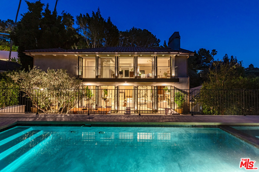 Tasteful and exquisite, this distinguished home is completed with no expense spared. Enter the home through gates to a beautiful gravel courtyard featuring an antique limestone fire pit and fountain imported from France. Dramatic spaces, soaring ceilings, Venetian plaster walls, limestone flooring, and French doors that open to a stunning and serene back yard with outdoor dining area, pool and cabana showcasing the southern city views. Designer quality kitchen outfitted with Officine Gullo range imported from Italy, Miele appliances and Calcutta Marble countertops. Upstairs: two en-suite bedrooms including the incredible Master Suite with dual balconies, fireplace and city views. Master bathroom is large with two closets and Greystone marble. On the main floor, two nicely appointed bedrooms with en-suite baths and theatre room. Downstairs, gym or additional living space plus the fifth en suite bedroom with separate entrance. This is a rare opportunity.
