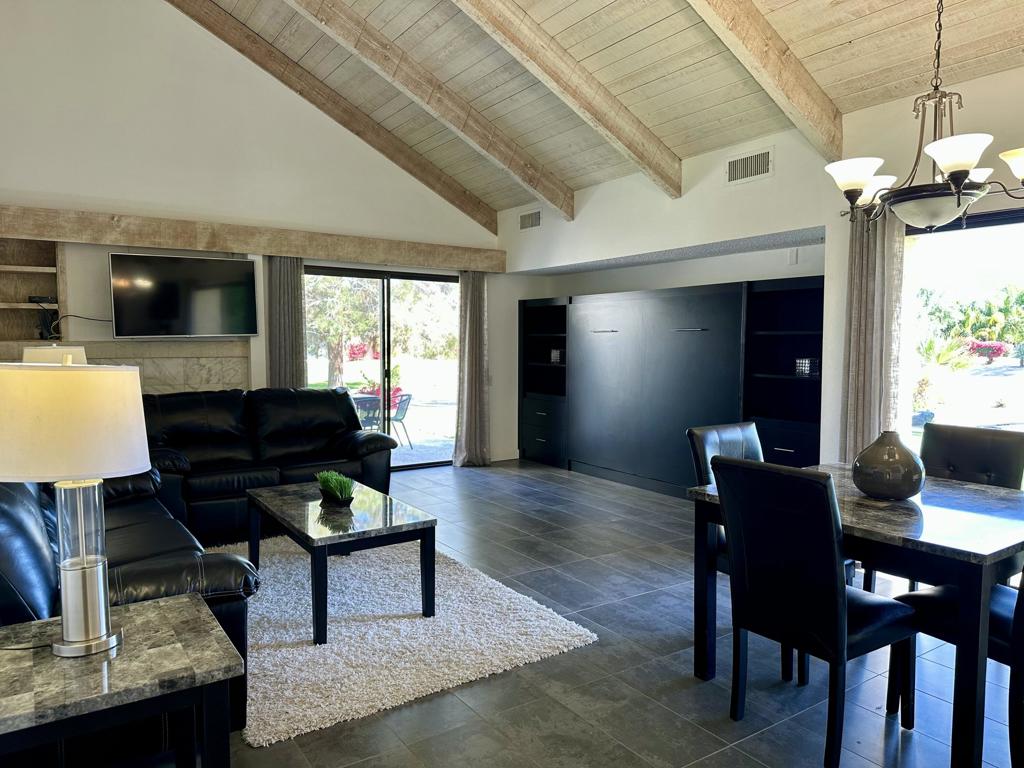 Prime Lakefront Living in the Desert!Discover the perfect blend of luxury and tranquility in this exquisite 1-bedroom, 1.5-bathroom Tennis Villa Condo, nestled within the highly sought-after Mission Hills Country Club. With breathtaking south-facing views of the mountains and adjacent to one of multiple lakes, this home offers a truly exceptional indoor-outdoor lifestyle.Spanning over 1,040 sq. ft., this residence features a spacious primary suite, offering privacy and comfort, separated by a private courtyard entrance. The expansive shaded patios invite you to relax while enjoying stunning mountain and green belt vistas - the perfect place to unwind or entertain.The inviting living room boasts soaring wood-beamed ceilings and a cozy fireplace, creating the ideal atmosphere for hosting guests.For added convenience, a private detached 2-car garage offers ample storage space. Residents of Mission Hills Country Club enjoy access to world-class amenities, including three championship golf courses, tennis, pickleball, and a variety of membership options. The HOA covers Spectrum cable TV, high-speed Wi-Fi, exterior building maintenance, roof and stucco care, trash service, common area landscaping, and access to four pools and spas.Live your dream life in this stunning desert oasis - where every day feels like a vacation.