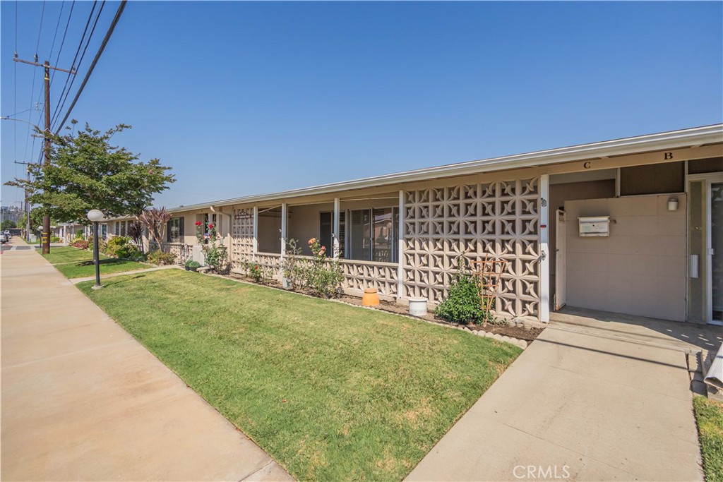 Located in the desirable 55+ community of Leisure World, this light-filled 2-bedroom, 1-bath home offers a bright living room with plantation shutters, a functional kitchen with ample storage, and a primary bedroom with direct patio access. The covered patio, accessible from both the living room and bedroom, features decorative block accents and skylights for year-round enjoyment. Community amenities include a golf course, pool, fitness center, library, and more—all just minutes from the beach.