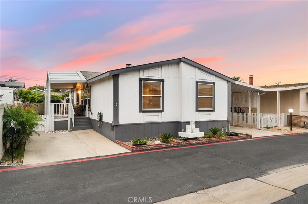 This 3 bed, 2 bath home checks all the boxes — starting with its open-concept layout, stylish updates, and only one neighbor thanks to its coveted corner lot location. The spacious peninsula kitchen boasts white quartz countertops, updated cabinetry, and flows seamlessly into the dining area and cozy living space complete with a fireplace and wood-style LVP flooring. Stay comfortable your way with efficient, cost-saving individual A/C wall units. You’ll love the inside laundry room, mirrored closet doors, and smart floor plan that makes daily living feel easy and efficient. Step outside and enjoy your own private oasis — a large backyard with planters, dragonfruit and avocado trees, a BIG covered side porch, and a private rear patio perfect for relaxing or entertaining. Need storage? You’ve got it — there's an extra storage shed out back for all your tools, toys, and gear. All of this in a 55+ community (secondary 40+) packed with resort-style perks: a clubhouse, sparkling pool, hot tub, putting green, BBQ area, game room, and a community library. Prime lot, prime upgrades, and a lifestyle to match — don’t miss out!