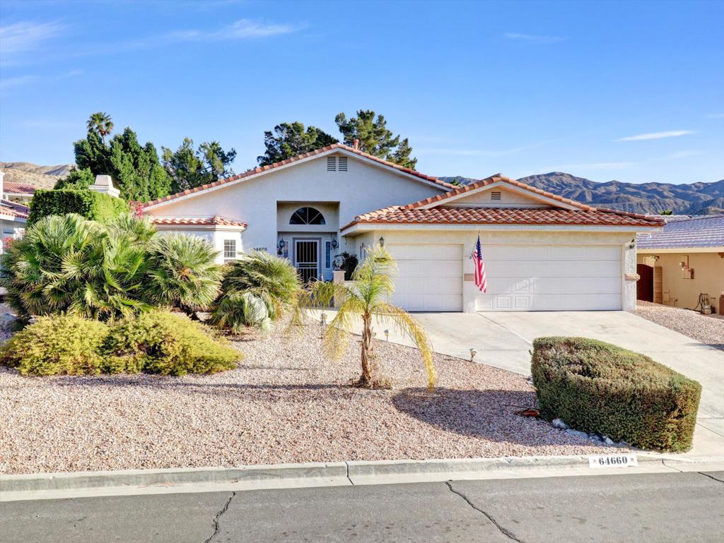 This is a wonderful 3 bedroom two bath home situated in Mission Lakes CC on a quiet cul-de-sac. The home offers great curb appeal. As you enter into an amazing private elevated court yard you cant miss the views of the beautiful mountain. When you enter the home there is a large living room space with high ceilings. This area is perfect for family friend gatherings. In the same space is a large formal dining area. As you enter the kitchen it has its own eating area for morning coffee. The kitchen has glass double doors that open to a beautiful private back patio and private spa. This yard is so peaceful with flowers and beautiful mature trees that add to so much privacy. All the bedrooms are very spacious one with a Murphy's bed for company. The Master has a large master bath with walk in closet and the master bedroom has a welcoming fireplace of its own. . There is a large two car garage with cart garage. If you are a golfer this is a no brainier you will get two on title to play unlimited golf for only 465 a month and a food minimum of 600 that must be spent for food in a year. This is a 18 hole Ted Robinson championship golf course! The other amenities are heated pool and spa, tennis courts pro shop, fitness room, restaurants and so much more to enjoy. There is a a leased solar for lower electric bills! The travel time to Palm Springs is 15 min and easy access to the hwy to the rest of the Valley....Great living Great community!