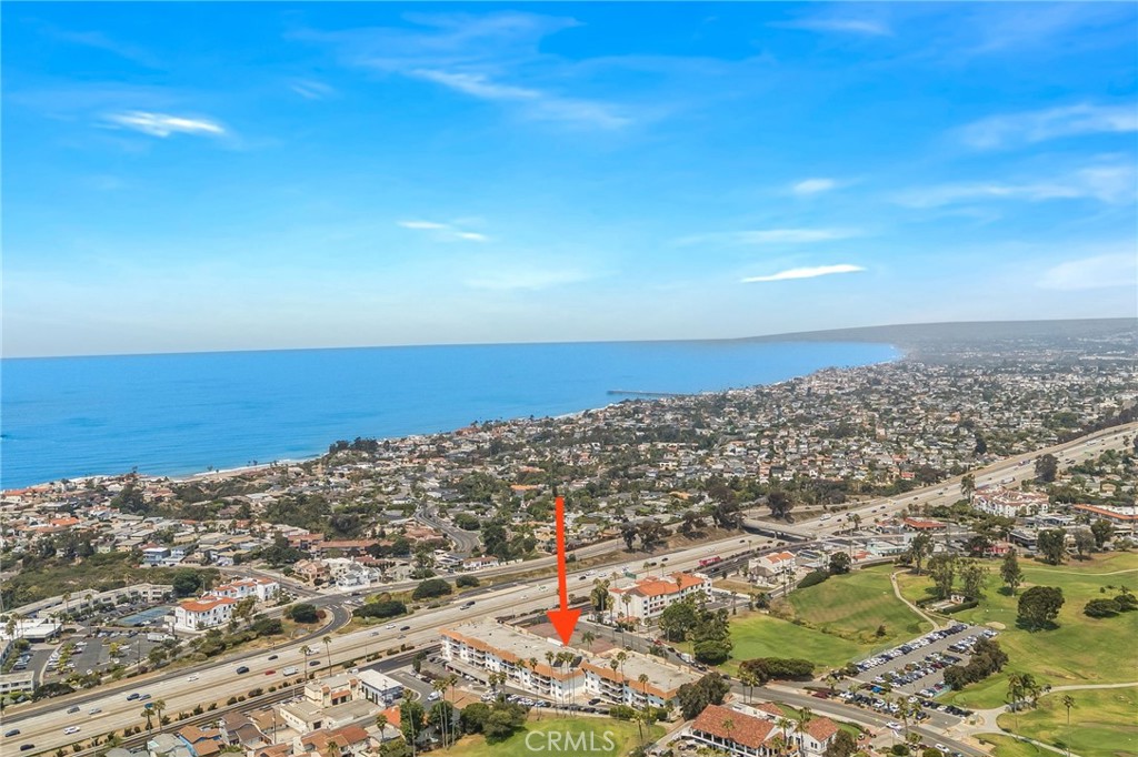 Experience ocean and golf course views from this beautifully upgraded 2-bedroom, 2-bath condo in the desirable Ocean Fairways community. Spanning over 1,300 sq ft, this spacious single-level-living condo offers an open-concept layout with new flooring throughout, a fully remodeled kitchen with custom pots/pans drawers, under-counter lights, custom-designed hutch, and a large dining area perfect for entertaining. The expansive living room features a striking custom fireplace, while the generous primary suite and well-sized second bedroom provide comfort, flexibility, and stunning views. Step out onto your private balcony to soak in more of the ocean, pool, and golf course views. Enjoy resort-style amenities in this gated community, including a pool, spa, tennis courts, recreation room, and more. Ideally located just steps from the San Clemente Municipal Golf Course and minutes from beaches, Trestles, Avenida Del Mar, shops, restaurants, and parks. Move-in ready—perfect for full-time living or a vacation retreat!