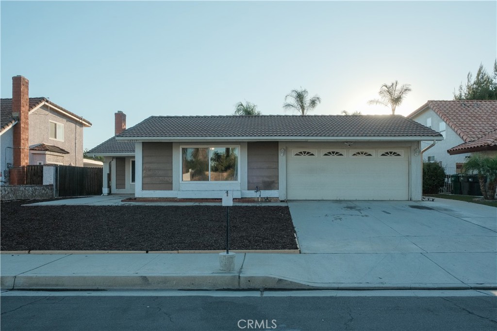 Welcome Home!!! Don't miss out on this unique opportunity to own this absolutely beautiful single story home that features open concept living with natural lighting. Located in a peaceful and highly desirable neighborhood of Moreno Valley, very close to Freeways, Schools, and walking distance from Mall & Restaurants. Home has tile throughout every room and living spacious of 1966 SF including an extra room w/closet and a Studio w/bathroom and kitchen and it's own entry, these additions are without permit. Home has Energy Saving windows throughout and New A.C. Unit. Enjoy a perfect evening in this home's back yard covered with cement, minimum maintenance required on both front and back of the house.Hurry before it's too late, make this your Family HOME.