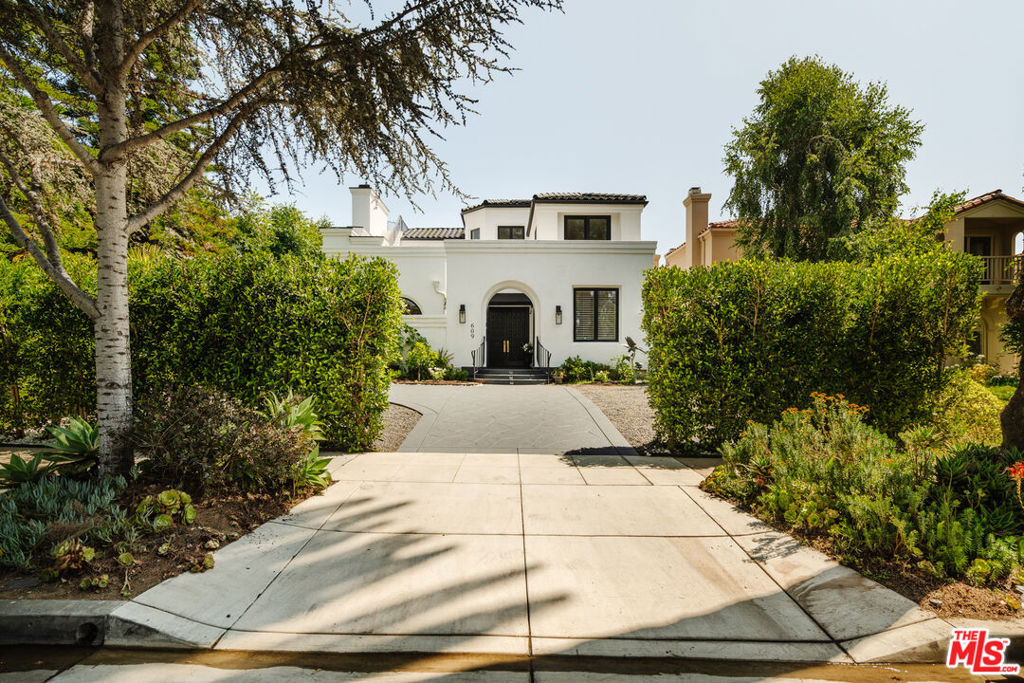 *Please note the dark-colored hardscape including front driveway/entryway, backyard, and primary suite's patio have been refinished in Grant Beige* Welcome home to 609 21st Place, a recently fully renovated 5 bed 5 1/2 bath, ~5,300 SQFT home with a pool, located on a quiet and serene street in one of LA's most prestigious neighborhoods, North of Montana. Exceptionally spacious and perfect for a large family, this home boasts tons of natural light throughout, greeted by a large foyer with a sweeping staircase, high ceilings with skylights, an office / den by the entryway, a guest / maids room with it's own access on the main floor, and a massive family kitchen which flows seamlessly to the family room, dining room, and backyard, creating an entertainer's dream. There are three fireplaces perfectly located throughout the home, one in the living room, family room, and primary suite. The primary suite features a beautiful outdoor patio area with a staircase leading to the roof, making it the perfect place to watch stunning sunsets! A detached garage at the rear of the property along with a driveway in the front, provides this home additional parking capacity and additional convenience.