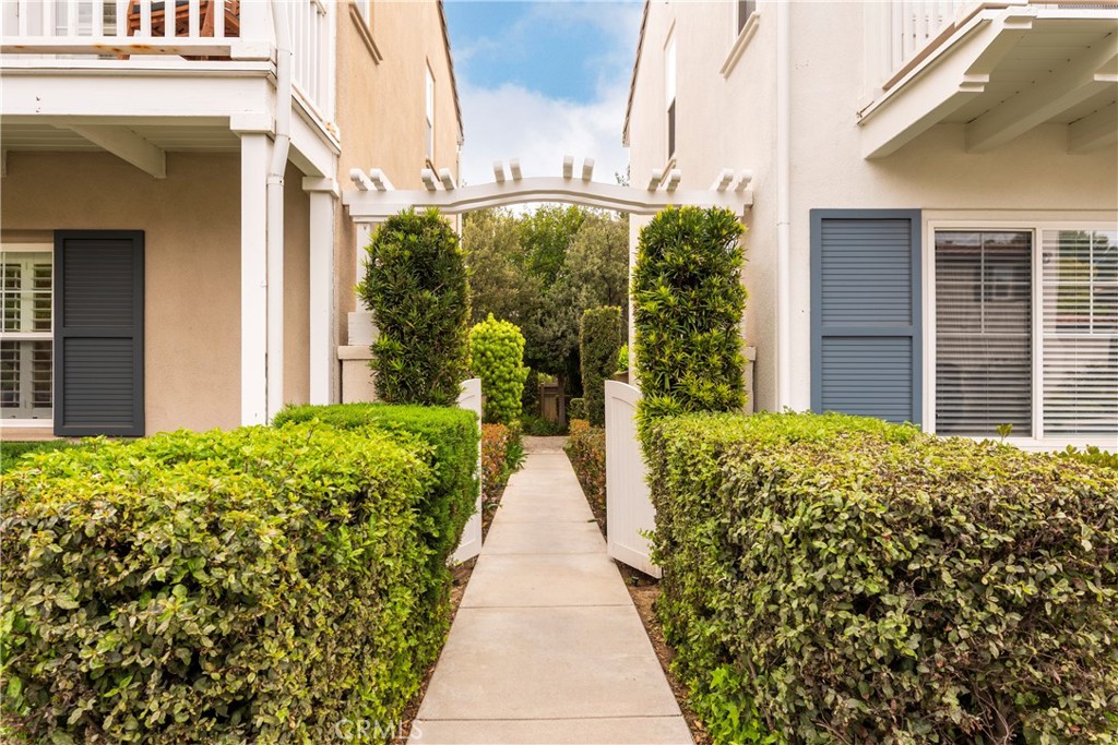 Welcome to your dream home in the prestigious Woodlands community of Valencia—a rare gem offering the perfect blend of warmth, elegance, and modern comfort. This beautifully upgraded 4-bedroom, 3-bathroom residence boasts an inviting layout, designer touches throughout, and a true sense of home from the moment you arrive. Step through the private, landscaped courtyard into a bright and stylish interior featuring luxury vinyl plank flooring, custom finishes, and abundant natural light. The spacious living room offers a sophisticated yet cozy ambiance with a stacked stone fireplace, wine display nook, and built-in cabinetry—perfect for both entertaining and relaxing evenings. The chef’s kitchen is a showstopper—complete with granite countertops, a large portable center island, upgraded stainless steel appliances, and an open flow to the formal dining area and private patio. Whether hosting a dinner party or enjoying a quiet breakfast, this space truly shines. Unique to this home is a charming under-stair reading nook/home office, ideal for work-from-home comfort or a whimsical hideaway. Upstairs, retreat to the generously sized bedrooms including a serene primary suite with en-suite bathroom, dual vanities, and a spacious walk-in closet. Each additional bedroom offers flexibility for guests, family, or a second office. Enjoy all the benefits of The Woodlands lifestyle—tree-lined streets, manicured grounds, walking trails, community amenities, and convenient access to award-winning schools, shopping, and dining