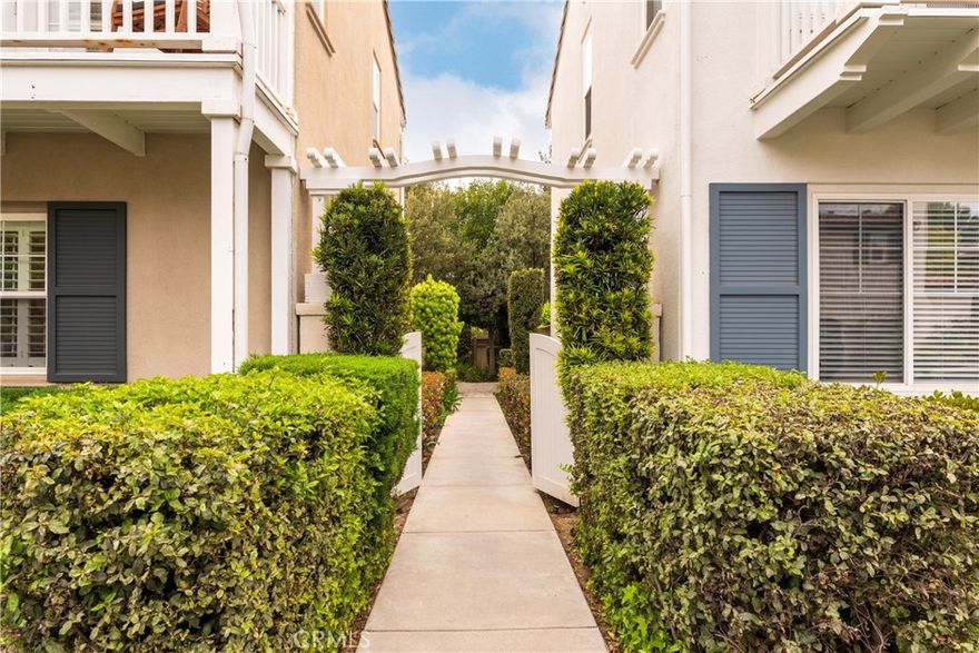 Welcome to your dream home in the prestigious Woodlands community of Valencia—a rare gem offering the perfect blend of warmth, elegance, and modern comfort. This beautifully upgraded 4-bedroom, 3-bathroom residence boasts an inviting layout, designer touches throughout, and a true sense of home from the moment you arrive. Step through the private, landscaped courtyard into a bright and stylish interior featuring luxury vinyl plank flooring, custom finishes, and abundant natural light. The spacious living room offers a sophisticated yet cozy ambiance with a stacked stone fireplace, wine display nook, and built-in cabinetry—perfect for both entertaining and relaxing evenings. The chef’s kitchen is a showstopper—complete with granite countertops, a large portable center island, upgraded stainless steel appliances, and an open flow to the formal dining area and private patio. Whether hosting a dinner party or enjoying a quiet breakfast, this space truly shines. Unique to this home is a charming under-stair reading nook/home office, ideal for work-from-home comfort or a whimsical hideaway. Upstairs, retreat to the generously sized bedrooms including a serene primary suite with en-suite bathroom, dual vanities, and a spacious walk-in closet. Each additional bedroom offers flexibility for guests, family, or a second office. Enjoy all the benefits of The Woodlands lifestyle—tree-lined streets, manicured grounds, walking trails, community amenities, and convenient access to award-winning schools, shopping, and dining