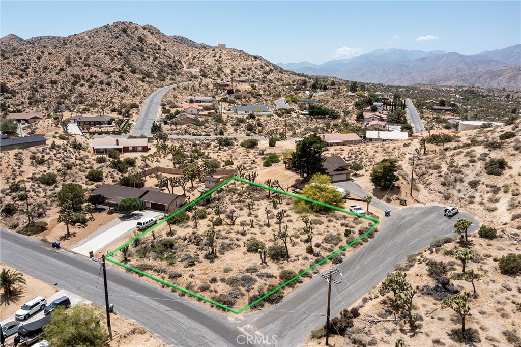 Juniper Terrace vacant parcel - one of the most desirable areas in Yucca Valley. Private, hillside location. Limited traffic as neighborhood has not through street - one must exit out of the east side of this special neighborhood in the same manner as they entered. Close to vast wilderness, perfect for hiking. Little known must see area for those exploring Hi Desert building site options.