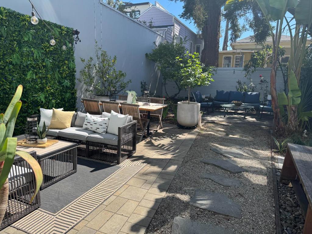 RARE TOWNHOME BEST BUY in Inner Mission! Superb 3-level townhome, w high ceilings, open floor plan in a 4plex by renowned Dan Solomon. Fully remodelld w permits in 2019: *Custom built ins from Chez Panisse craftsmen, *Heath tile baths, *Wide plank rift-sawn white oak flooring throughout, *Skylights, European-style high performance windows, *Chefs kitchen w Thermador professional SS appliances, 6-burner gas, 600cfm hood, Silestone countertops, Kraftmaid cabinets, storage/pantry, *Custom premium closets, *French doors to garden of mature redwoods,palms,roses,fruit trees,citrus and cacti,*Professional acoustic soundproofed shared bedroom walls with MLV and resilient channel, *Hardwired Nest smoke detectors, thermostat, security cameras, *Fiber internet, *Glass staircase panels, *Energy Star W/D w steam, *Designer fixture, light fixtures, LED recessed,*Robern lighted frameless mirrored cabinets, *Frameless shower doors, *Hunter Douglass in LR, blocking shades BRs, *Bay Bridge+skyline view BR. Quiet rear unit 60 ft set back, deeded paved LARGE PATIO, wall garden, *Reinforced foundation on bedrock w shear walls for seismic stability,*New roof, recent exterior paint, *Parking: 1deeded in gated courtyard,* Storage: 1outside closet,*walk to BART, *all that w $425 HOA incl. water/garbage!