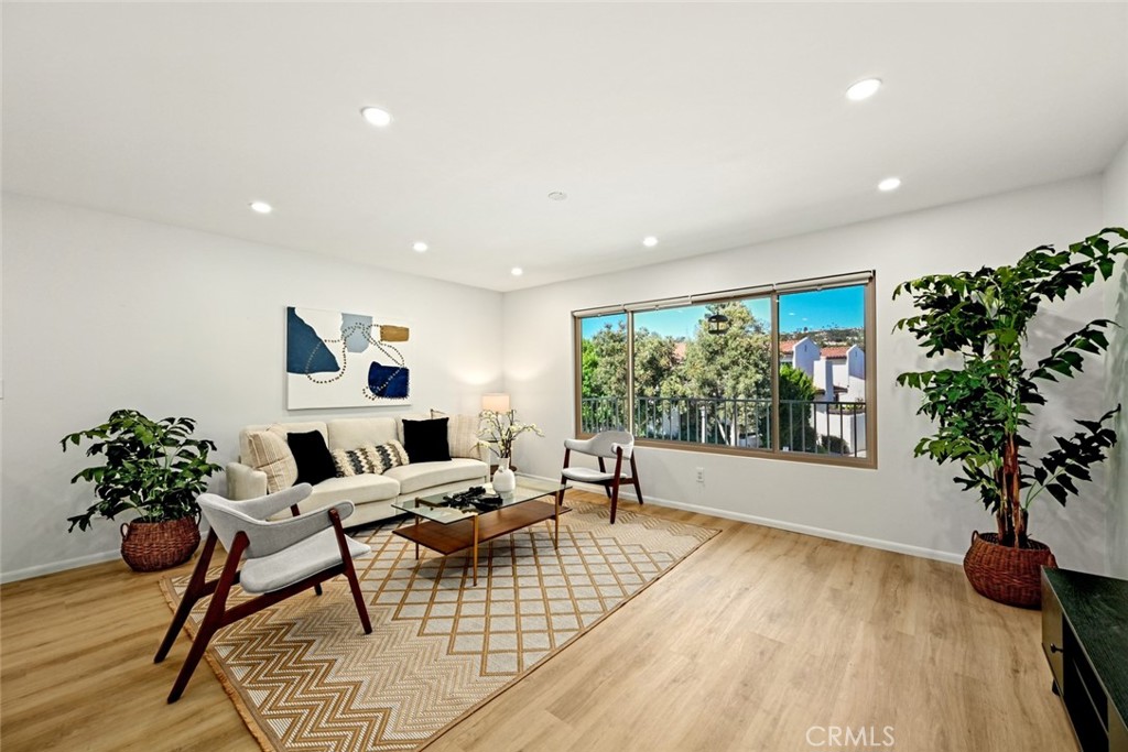 Stunning 2 bed, 2 bath condo located in the desirable Sandtrap Villas community offers a spacious and open floor plan with private balcony and covered patio area, as well as an attached 2-car garage, and in-unit laundry. The interior has been highly updated and features recessed lights, an abundance of natural light, and wood floors. The main floor is located on the 2nd floor with spacious living room, remodeled kitchen offering a large center island with breakfast bar seating, electric range with hood and white cabinetry with plenty of storage space. There is also a dining area just off of the kitchen and a guest bathroom. The primary suite with beautifully updated ensuite complete the 2nd floor. Downstairs you will be greeted by a large family room that features a built-in wet bar - great for entertaining guests. The 2nd bedroom, a 2nd full-size bathroom, and the laundry room are also located on the 1st floor. This gorgeous home sits just off of the Golf Course and is conveniently located near shopping, dining, trails, the beach, and all that Carlsbad has to offer! Schedule your private tour today!