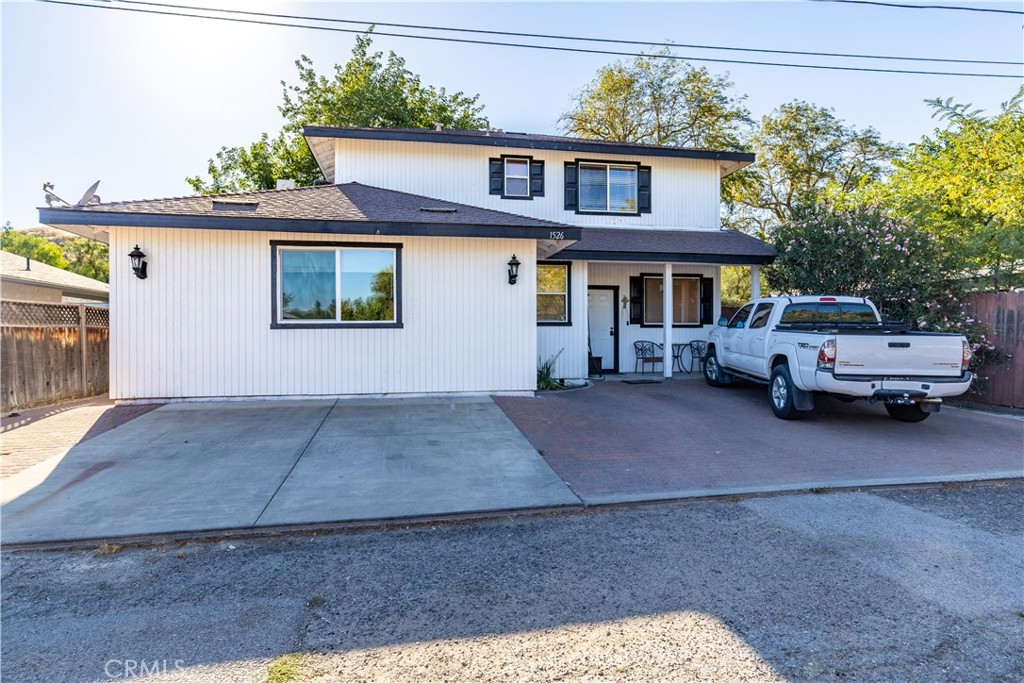 Looking for a great family home property or investment opportunity. 1524 and 1526 K St. offers two homes in a great San Miguel location, each with its own addresses!! 1526 K St. was built in 2004 offering 3 bedrooms and 2.5 bath, split level floor plan with permitted conversion of the 2 car garage adding versatility to the already generous floor plan with it's spacious back yard and private alley location. The kitchen is well appointed with open space for entertaining and family gatherings. A walk in pantry offers more storage solutions and a living room slider to the spacious fenced rear yard offers lots of indoor and outdoor space to spread out. Upstairs you will enjoy the Master bedroom and its own private master bath as well as the 2 additional guest rooms with a full guest bath. The efficent powder bath downstairs is always a nice convenience. Outside the large, private rear yard has a gated fence dividing the homes. 1524 K St. offers 1 bed, 1 bath and fronts K St. Both homes have their own individual access 1524 off K St. and 1526 via the alley.This arrangement is perfect for combining families while maintaining privacy or generating strong rental income. With easy access to Highway 101 for commuting, this property is a truly compelling opportunity.