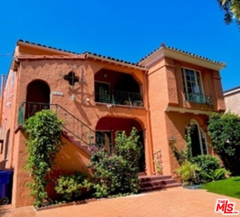 Beautiful Spanish Duplex with the ideal combination of the charms and sophistication of authentic 1930's architecture fused with the ease and enjoyment of a modern kitchen and appliances. Unit is the entire downstairs "owner's unit" featuring a formal living room with refinished hardwood floors, high coved ceilings and a fireplace. Formal dining room. Gorgeous recently updated kitchen with quartz counters, tons of new cabinets and high end stainless appliances. Washer, Dryer and Refrigerator included. Huge primary bedroom with large walk-in closet and newly updated bath. Second bedroom with hardwood floors. Fabulous Art Deco full bathroom. Shared use of the fenced backyard with an orange tree. Units comes with at the use of 1 Private Garage for Storage, and one Parking Space in the front driveway. One Small pet considered. Avail now for 1 year or longer.