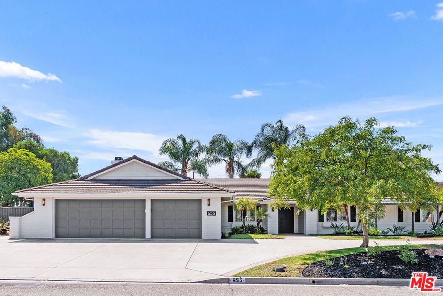 Step into this fully renovated designer home, crafted by a renowned luxury builder. Every detail has been thoughtfully reimagined, creating the feel of a brand-new custom residence. This spacious 4-bedroom, 3-bath home combines modern design with comfort. The open floor plan, soaring ceilings, and abundant natural light create an airy flow throughout. Multiple living areas, including a formal living room, large family room with wet bar, and elegant dining space, provide flexibility for entertaining and everyday living. The chef's kitchen is a true highlight, featuring sleek cabinetry, high-end stainless steel appliances, stone countertops, and an eat-in breakfast nook surrounded by windows. Just beyond, the home's three fireplaces add warmth and character to the living spaces.Retreat to the primary suite, complete with a custom fireplace, walk-in closet, and a spa-inspired bathroom boasting dual vanities, an oversized shower, and soaking tub. Additional bedrooms are generously sized with modern finishes. Outdoors, enjoy a half-acre fenced yard offering privacy, mature landscaping, and scenic mountain views. Covered patios and a private hot tub create the perfect setting for relaxation or gatherings. Landscaping service is included. Practical amenities include a laundry room with washer & dryer, ample built-in storage, circular driveway, and attached garage. A full solar system offsets most electricity costs, making the home as efficient as it is beautiful. Located in a quiet, safe neighborhood close to shopping, restaurants, and other conveniences, this home blends privacy, style, and everyday luxury.