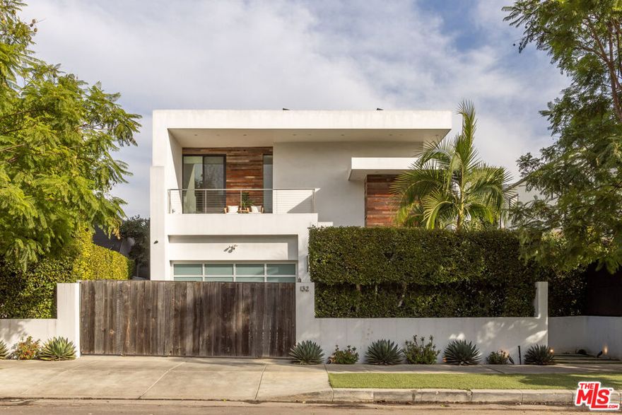 Located in the heart of Beverly Grove, this modern home offers a great mix of style, comfort, and space. With about 4,000 square feet, it features 5 bedrooms and 6 bathrooms - all en suite - giving everyone plenty of privacy. Willing to sell furnished or unfurnished. Inside, you'll find soaring ceilings and a striking floating staircase that add to the open, airy feel. The kitchen is fully equipped with high-end appliances, perfect for cooking or entertaining. The living room, complete with a fireplace, opens smoothly to the backyard, creating an easy flow between indoor and outdoor spaces. The backyard is a true retreat, with a saltwater pool, spa, mature landscaping, and plenty of room for relaxing or hosting. There's also an outdoor fireplace and TV area that make it a great spot to unwind with friends or family. The master suite stands out with its own fireplace, walk-in closet, sundeck, and a luxurious bathroom with Porcelanosa finishes. The home is also outfitted with smart technology and solar panels for energy efficiency. This gated property offers both privacy and convenience, just minutes from The Grove and the Sunset Strip - some of LA's best dining, shopping, and entertainment. If you want a stylish, comfortable home with plenty of room to live and entertain, 132 N Laurel Ave is a wonderful choice.