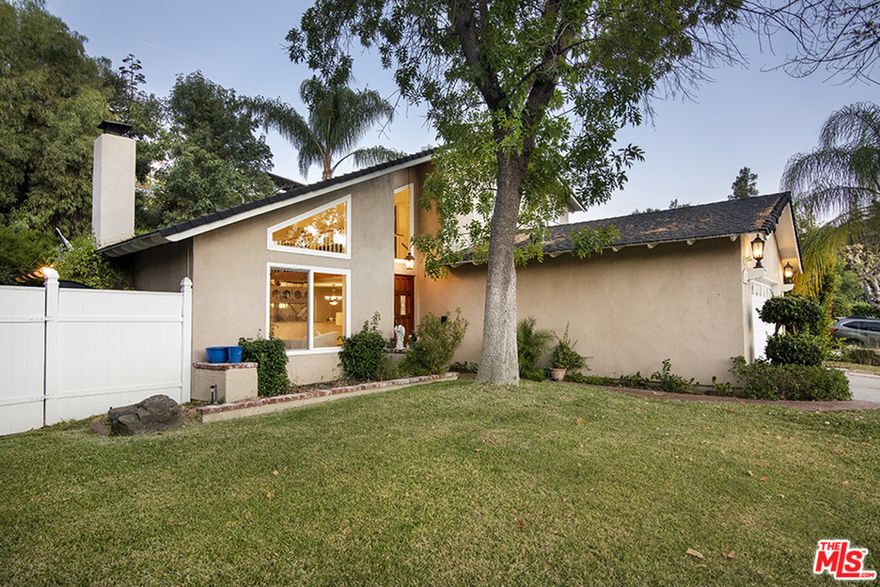 Light, open and comfortable four-bedroom home sited next to Lake Lindero. The large open entertaining space with cathedral ceilings includes a formal dining room and bar. French doors open up to a private enclosed patio and backyard with a built-in BBQ. The main bedroom offers an en-suite bath and walk-in closet. Access to Lake Lindero's clubhouse with restaurant, tennis courts, pool, and golf. Close proximity to parks and highly ranked schools.