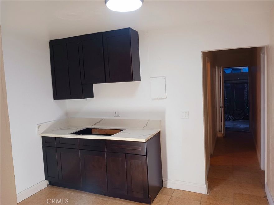 This is a two-bedroom apartment on the ground level. The unit is fully remodeled, 

brand-new kitchen cabinets, sink, and kitchen hood. The rooms have ceiling fans, and there is a split AC unit installed in the living room area. All the units have an assigned car open space parking spot. Available now.