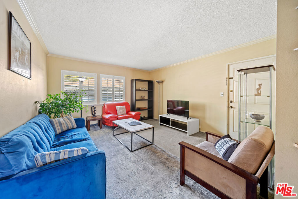 Welcome to Cameo Woods! This top-floor 2-bedroom, 1.5-bath home is filled with natural light and offers the perfect blend of style, comfort, and convenience in one of Los Angeles' most desirable gated communities. The open living and dining areas are warm and inviting, with a seamless flow that makes both relaxing and entertaining effortless. The kitchen offers abundant cabinetry and generous counter space, while an in-unit stackable washer and dryer adds everyday convenience. Both bedrooms are spacious and bright, and feature large closets. A private 1-car garage offers additional storage. Residents enjoy resort-style amenities including a sparkling pool, two spas, a tennis court, clubhouse, dog park, guest parking and beautifully landscaped walking paths all within a secure, 24-hour guard-gated setting. Set in the community's best and most tucked-away building, furthest from Obama Blvd and La Cienega Blvd, this home offers exceptional privacy and peace. The location is unbeatable: just minutes from the Culver City Steps, Baldwin Hills Scenic Overlook, and the Expo Line, with Target right across the street. Culver City, Downtown LA, and LAX are also within easy reach. More than just a condo, this is a lifestyle; calm, connected, and ready to enjoy.