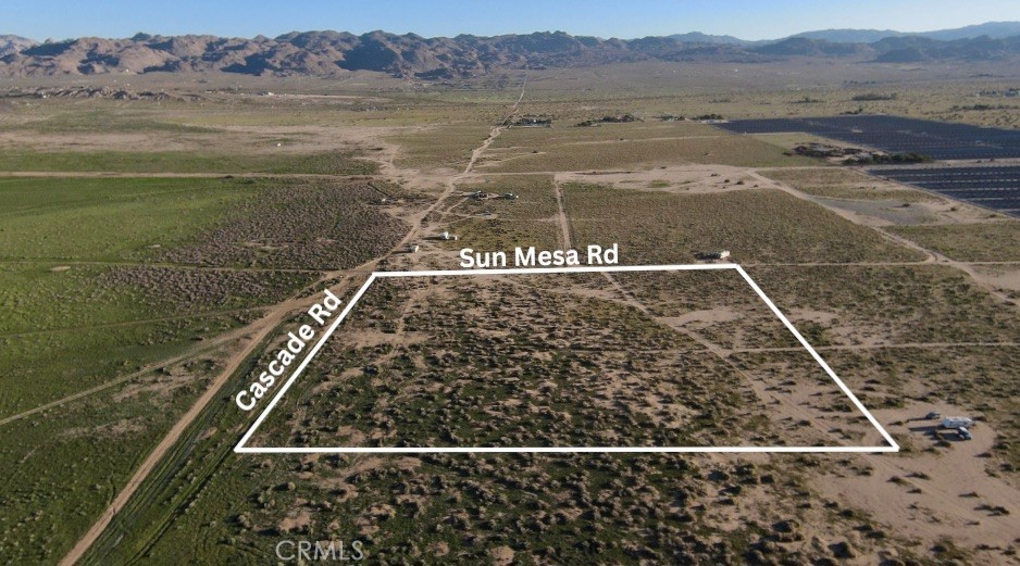 Discover 10 acres of stunning desert landscape on the border of SunFair West and SunFair East, placing you right at the doorstep of the SunFair Lakebed. Perfectly positioned at the corner of Sun Mesa Rd and Cascade Rd, this parcel offers both easy access and ultimate seclusion—an ideal spot to escape the busyness of everyday life. Whether you’re looking to build your dream desert retreat, invest in future development, or simply enjoy a unique private getaway, this lot delivers. Overhead powerlines make utility connection simple, while a private well will be needed for water.
All lot lines shown in photos are approximate. Buyer to verify access to utilities and all property details.