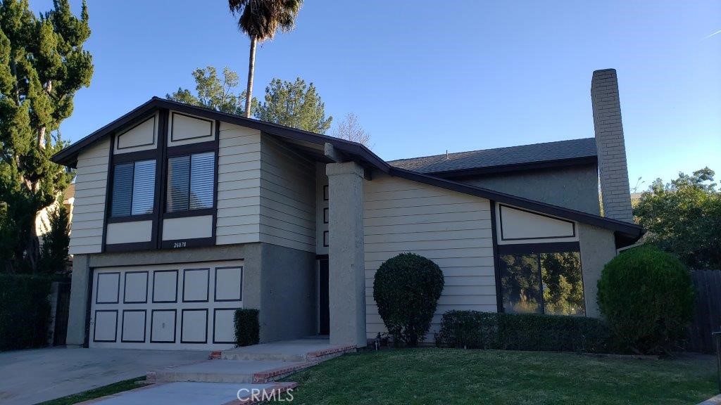 Located in the sought-after Calabasas community, this charming single-family home offers 4 bedrooms/3 bathrooms with 2,562 square feet of living space. Situated on a generous 0.28-acre lot, the property provides ample outdoor space, great for entertaining. Enjoy comfortable living with features such as central cooling & heating, laminate wood flooring downstairs with carpeting upstairs. The home includes a living room with fireplace, a family room, formal dining area, a spacious loft (20'x20'), and inside laundry hookups for convenience. The kitchen is equipped with essential appliances which include a dishwasher, garbage disposal, refrigerator, range/oven and granite countertops. There's also a 2-car attached/direct access garage. Located in the vibrant community of Calabasas, known for its luxury living, excellent schools, and recreational opportunities. Take advantage of nearby shopping at The Commons and The Village at Westfield Topanga, as well as upscale grocery options like Gelson's and Bristol Farms. The highly-regarded Las Virgenes Unified School District serves the area, including notable schools like Wright Middle and Calabasas High School as well as Pepperdine University. This home is ready for its new tenants.