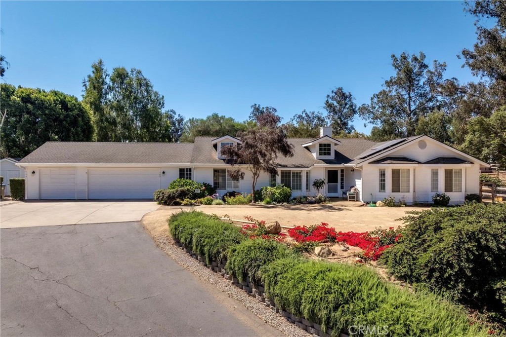 Welcome to 760 Black Oak Ln. — a rare opportunity to enjoy land, privacy, and a beautifully updated horse property all in one.
Tucked at the end of a cul-de-sac on a private road, this newly remodeled single-level home features 3 bedrooms, 2.5 bathrooms, and a 3-car garage on a versatile ~one-acre lot. Vaulted ceilings, natural light, and real wood floors create an inviting, open layout, enhanced by plantation shutters throughout.
The gourmet kitchen serves as the heart of the home, designed for both entertaining and everyday living. Showcasing two large center islands, one with barstool seating, providing generous counter space, and added storage. Elegant granite counters pair with a marble subway tile backsplash, warm white custom cabinetry, soft-close cabinets and drawers, and a Wolf range. Recessed lighting adds a modern touch, and a window overlooking the backyard completes the space.
The private primary suite offers a spacious retreat, featuring a walk-in closet and a fully updated en suite bathroom with a soaking tub, walk-in shower, and a dual-sink vanity with modern finishes. Two additional bedrooms include bay windows and large closets, while the updated hall bathroom features a tub-shower combination and a new dual-sink vanity with a gorgeous countertop. A conveniently located half bath sits just off the kitchen, and a separate laundry room offers direct access to the backyard and garage.
Outdoors, the property is equally impressive. The expansive yard is tailored for relaxation or gatherings with a fully equipped outdoor kitchen, fire pit with seating, and a large, serene koi pond with a waterfall. Recent upgrades include solar panels with two Tesla backup batteries for efficiency and peace of mind. This versatile property is ready for your lifestyle—bring your horses, chickens, RV, and toys. Additional newly-added features include covered RV parking with hookups, a fenced pasture with a stall, a tack shed, and a custom 11’ x 11’ tool shed with 10-foot ceilings.
Thoughtfully improved and move-in ready, this property offers the rare combination of privacy, practicality, and modern comfort. No HOA.