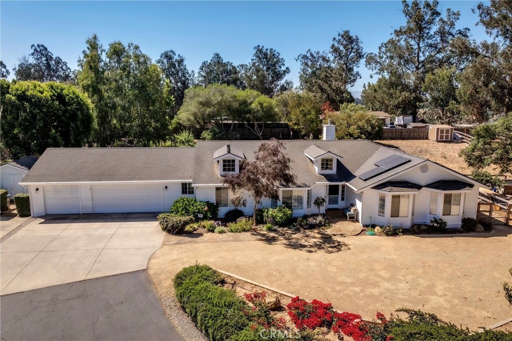 Welcome to 760 Black Oak Lane. This home offers a rare opportunity to enjoy land, privacy, and a beautifully updated horse property all in one.
Perched at the end of a cul-de-sac on a private road, this newly remodeled single-level home features 3 bedrooms, 2.5 bathrooms, and a 3-car garage on a versatile ~one-acre lot. Vaulted ceilings, natural light, and real wood floors create an inviting, open layout, enhanced by plantation shutters throughout.
The gourmet kitchen serves as the heart of the home, designed for both entertaining and everyday living. It showcases two large center islands—one with barstool seating, providing generous counter space and added storage. Elegant granite counters pair beautifully with a marble subway tile backsplash, warm white custom cabinetry, soft-close drawers, and a Wolf range. Recessed lighting adds a modern touch, and a picture window overlooking the backyard completes the space.
The private primary suite offers a spacious retreat, featuring a walk-in closet and a fully updated en suite bathroom with a soaking tub, walk-in shower, and dual-sink vanity with modern finishes. Two additional bedrooms include bay windows and large closets, while the updated hall bathroom features a tub-shower combination and new dual-sink vanity with a gorgeous countertop. A conveniently located half bath sits just off the kitchen, and a separate laundry room offers direct access to the backyard and garage.
Step outside to your personal oasis, perfect for relaxing, entertaining, or enjoying the outdoors. The expansive backyard features a large grassy area, a garden space, and multiple gathering areas. An outdoor kitchen, cozy fire pit with seating, and a tranquil koi pond with a cascading waterfall set the scene for year-round enjoyment.
Bring your horses, chickens, RV, and toys—there’s room for it all. The property includes covered RV parking, a fully fenced yard, pasture with a stall, a tack shed, and a custom 11’ x 11’ tool shed with space to add a workshop, ADU, pool, or even expand the home; the possibilities are endless.
Meticulously maintained and move-in ready, 760 Black Oak Lane blends modern comfort with country charm—offering the rare balance of privacy, practicality, and style.