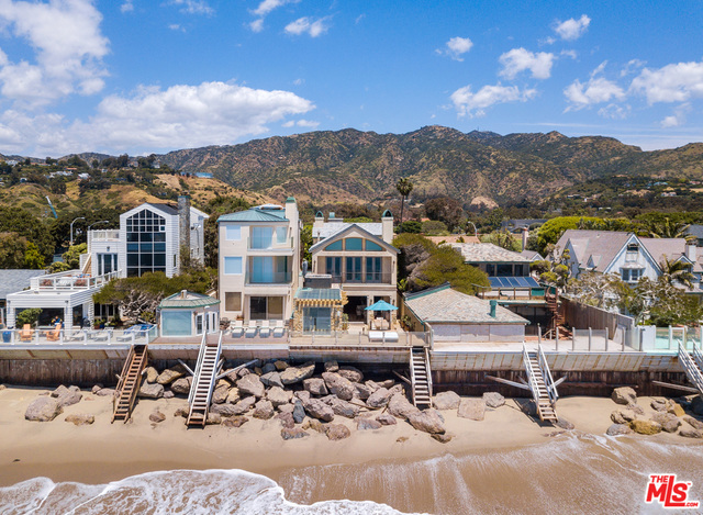 Elegant yet warm and inviting, this 3-story French Country Villa-style beach home is located in one of the most desirable and gated Malibu neighborhoods, w/direct beach access. The Crestron™ system home features an open great room w/fireplace, gourmet kitchen w/fireplace and dining room w/climate controlled wine cellar that flows out to a spectacular oceanfront entertainment deck w/fireplace, flat screen TV w/audio and speaker zone and complete barbecue area. The ocean view owner's suite w/fireplace and private deck w/hot tub has a lovely spa-like bath w/fireplace & two large closets. The media room w/fireplace has built-in seating and complete integrated video/audio system, Apple TV & computer connection capabilities. There are 4 additional bedrooms, ocean view private office, an elevator w/3 stops, Wi-Fi throughout, reclaimed American chestnut floors and antique doors, 2-car garage w/2 extra parking spaces & so much more. Also available for lease.